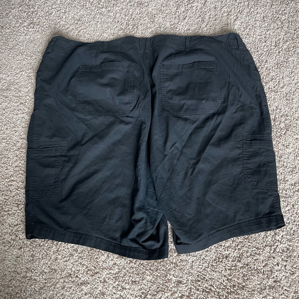 Bermuda length shorts.  Bermuda pockets on each side. Zipper/Buttons. 98% cotton